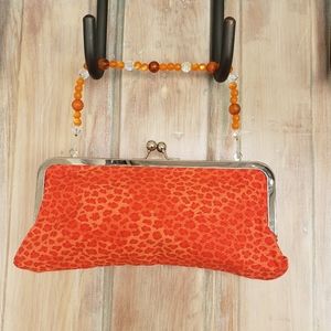 Orange leopard print clutch purse